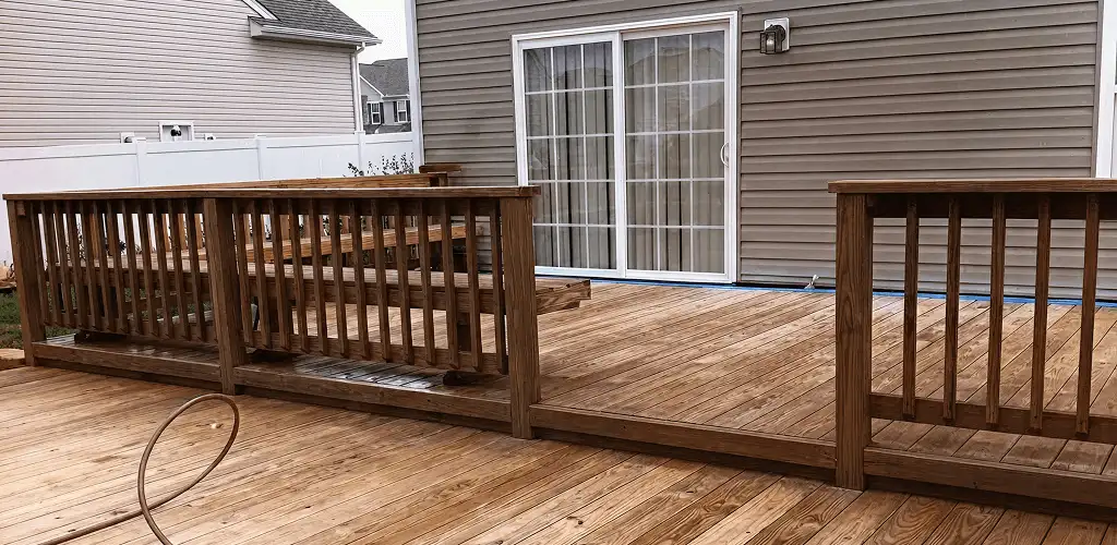 Deck sealing service protecting a backyard wood deck and railings in Reno, NV