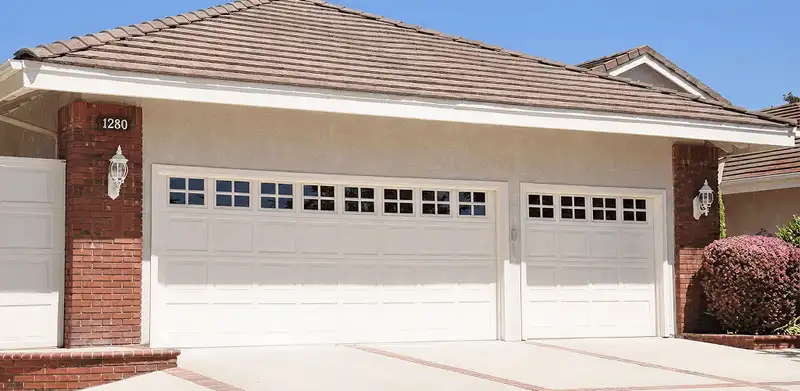 Residential garage door repair service for a double garage door in Reno, NV