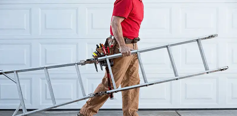 Garage door repair technician arriving with tools and ladder in Reno, NV
