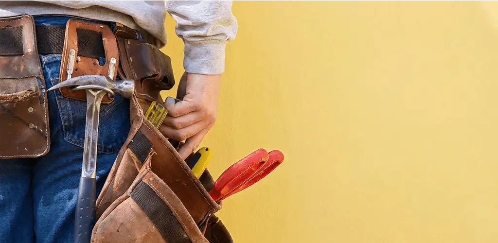 Handyman with tool belt ready for home repairs and maintenance in Reno, NV