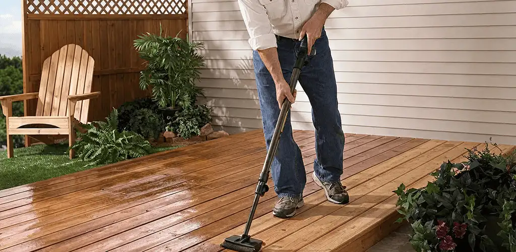 Deck staining service applying stain to a backyard wood deck in Reno, NV